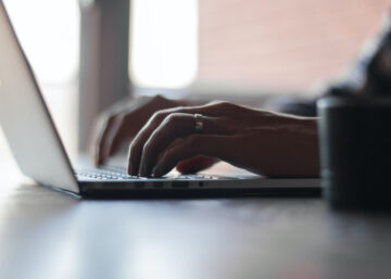 Typing on laptop