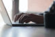 Typing on laptop